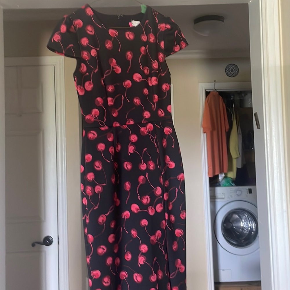 Betsy Johnson size 4 capped sleeve dress. Knee high slit on the left side